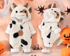 🎃 Get Ready for Spooky Cuteness with the Halloween Baby Cow Costume! Transform your little one into the cutest member of the herd this spooky season with our Halloween Baby Cow Costume. This adorable baby romper is perfect for adding a playful twist to your child's Halloween look, making it a must-have for all the little trick-or-treaters. 👶 FEATURES: - Cute & Comfy: Crafted from soft, breathable fabric, this romper keeps your baby cozy while adding a dash of fun to their spooky season wardrob White Long Sleeve Onesie Costume, White Onesie Halloween Costume, Playful Halloween Costume Onesie, Cute Halloween Onesie For Playtime, Playful Halloween Onesie With Cartoon Print, Cute White Halloween Onesie, Adorable Dresses, Halloween Infantil, Cow Costume