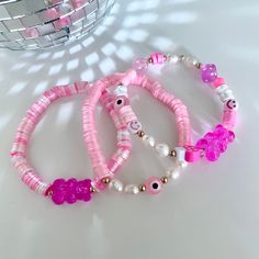 These 3 styles of pink bracelets are handmade and made to order with 0.5 mm elastic with a strong closure for more durability. Statement bracelet made with stainless steel, clay, genuine natural pearls and acrylic beads. This bracelet is perfect to wear on their own or stack with other colors and styles. Perfect as gifts for birthdays, Christmas, summer, valentine's day, easter or any occasion! we have different sizes available! Pink Flexible Beaded Bracelets For Gifts, Pink Beaded Bracelets For Gift, Trendy Pink Heishi Beads Stretch Bracelet, Flexible Pink Beaded Bracelets, Flexible Pink Beaded Bracelet, Handmade Flexible Pink Bracelets, Adjustable Pink Pearl Bracelet With Spacer Beads, Trendy Pink Heishi Beads Bracelet, Pink Heishi Beads Beaded Bracelets