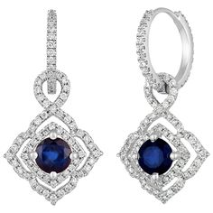 The earrings are 18K White Gold There are 0.80 Carats In Diamonds F/G VS/SI There are 1.47 Carats In Blue Sapphires The round sapphires are prong set in a double square halo The earrings measure 1" x 0.50" The earrings weigh 4.8 grams The dangle part can be removed from the hoop. The hoops can be worn by themselves. Gia Certified Sapphire Earrings For Formal Occasions, Luxury Sapphire Diamond Earrings With Brilliant Cut, Gia Certified Sapphire Diamond Earrings For Formal Occasions, Formal Gia Certified Sapphire Diamond Earrings, Gemstone Diamond Earrings For Evening, Evening Diamond Earrings With Gemstone, Evening Round Diamond Earrings With Gemstone, Evening Diamond Round Earrings, Elegant Blue Gia Certified Diamond Earrings