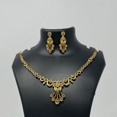 Description: Premium Quality  Gold Plated CZ necklace and matching earrings are lightweight and made with the highest quality craftsmanship. They are a stunning addition to any outfit and will make a perfect gift for any occasion. Features: Crystal stones Lightweight and elegant Can be paired with any dress, kurti, or saree DESIGN: we have 4 different necklace sets in this Listing 1. Gold Dangle Set 2.Flower Pearl Drop 3.All Flowers 🌸 1 4. All Flowers 🌸 2 Material: Cubic Zirconia (CZ) Stones P Gold Diamond Bridal Necklace With Matching Earrings, Formal Gold Plated Filigree Jewelry Sets, Elegant Filigree Jewelry Sets, Elegant Filigree Jewelry Sets For Celebration, Elegant Gold Plated Filigree Jewelry Sets, Elegant Gold-plated Filigree Jewelry Sets, Gold Plated Necklaces With Matching Earrings For Anniversary, Gold Diamond Jewelry Sets With Earrings, Gold Diamond Jewelry Set With Matching Earrings