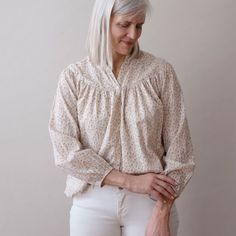 About Our Isobel top is super soft, flowy, oversized and flattering on everyone. S/M: 21.5" wide, 22" long L/XL: 24" wide, 24.5" long 100% lightweight cotton Block printed with non-toxic, azo free dyes Process Our designs are hand carved into teak wood blocks, and then hand block printed onto soft cotton. We use water based, non-toxic, AZO-free dyes. Every step of our production is done by hand in small batches by a network of artisans in Jaipur. Care -Machine wash cold with like colors-Dry on l Spring Daywear Peasant Top With Relaxed Fit, Chic Floral Print Blouse For Loungewear, Feminine Relaxed Fit Peasant Top For Daywear, Chic Blouse With Floral Print For Loungewear, Effortless Fall Daywear Blouse, Beige Cotton Peasant Top For Spring, Billowy Long Sleeve Cotton Peasant Top, Billowy Cotton Blouse For Fall, Effortless Long Sleeve Cotton Blouse