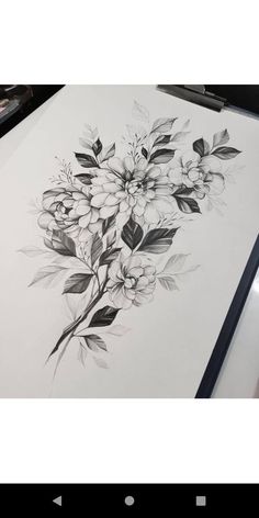 a drawing on paper with flowers and leaves