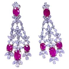 An exclusive pair of earrings in refined design, so beautiful and particular, a very master piece. Earrings come in 18k gold with 8 pieces of natural Burma Rubies in perfect oval cut, extra fine quality, spectacular color , of 11,08 carats, and natural diamonds in special cut of 7,83 carats, F color and VS clarity, top selection. Handcrafted by artisan goldsmith. Excellent manufacture and quality of stones. Complete with AIG report. Whosale price. Note: on my shipment, no taxes. For European customers, I have available shipment from Italy. Luxury Ruby Earrings Fine Jewelry, Luxury Ruby Earrings With Gemstone Accents, Luxury Ruby Chandelier Earrings, Red Gems, Exquisite Red Multi-stone Jewelry, Luxury Multi-stone Dangle Chandelier Earrings, 18k Gold Earrings, Master Piece, Earrings Collection