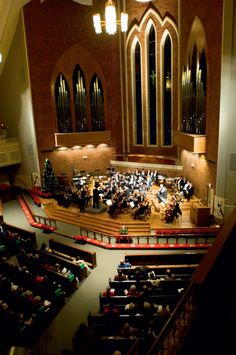 an overhead view of a concert hall with people sitting in the pews and playing instruments