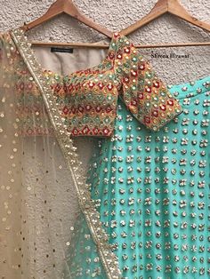 Threadwork and mirror work embroidered raw silk blouse teamed with glam aqua embellished lehenga and gold tulle dupatta with gold border Fabric: Net, Raw Silk Care Instructions: Steam iron & Dry clean only Size Chart (In Inches): XS S M L XL Chest 32 34 36 38 40 Waist 26 28 30 32 34 Hip 34 36 38 40 42 The product will be shipped within 6-8 weeks of the order placed. Email us on info@trendroots.com for urgent delivery of orders. Unstitched Gota Work Blouse Piece For Reception, Chanderi Traditional Wear With Sequins For Reception, Multicolor Embroidery Lehenga With Gota Work, Gota Work Blouse Piece For Reception And Diwali, Diwali Reception Blouse Piece With Gota Work, Fitted Embroidered Saree Fabric With Gota Work, Party Choli With Multicolor Embroidery And Mirror Work, Reception Saree With Gota Work Embroidery, Traditional Sequined Anarkali Set For Receptions