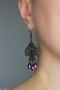 Beautiful and unique boho earrings with purple czech glass 6x9 mm drop beads,  antique copper chandelier charms and antique copper earring hooks. Earring hooks are from nickel free and lead free metal. Unique jewelry for your boho outfit or a great gift for someone special! *The total lenght of earrings is about 65 mm including earring hooks. Other earrings of my shop you can see here: https://www.etsy.com/shop/NaTavelli?section_id=13757927  Thanks for visit. Ethno Style, Boho Earring, Copper Chandelier, Boho Outfit, Earrings Purple, Beads Earrings, Teardrop Beads, Drop Beads, Earring Hooks