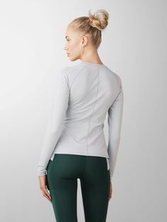 BPA & PFAS free athletic long sleeve shirt with princess panels that visually snatch your waist. Crew neck Curved contrast panels Body skimming Split hem Moisture wicking Made from sustainable materials 79% Recycled Repreve Polyester 21% Spandex BlueSign Approved BPA & PFAS free Why you’ll love: Streamlined Long Sleeve Top, a lightweight workout layer that's as versatile as it is stylish. Whether you're practicing yoga or embracing an active lifestyle beyond the studio, this top is a forward stu Athleisure Top For Light Exercise With Stretch, Stretch Athleisure Top For Light Exercise, High Stretch Athleisure Top For Light Exercise, High Stretch Sporty Tops For Light Exercise, Fitted Tops For Light Exercise In Athleisure Style, High Stretch Athleisure Tops For Sports, Compressive Sportswear Tops, High Stretch Sportswear Tops For Light Exercise, Sporty Moisture-wicking Tops For Pilates