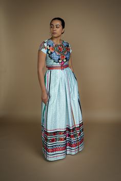 Based in: México The Talavera Capsule Collection, first introduced in 2019, returns with a limited selection available to order through our collaboration with Nayibi. This collection draws inspiration from the traditional art of Talavera, a centuries-old technique for crafting earthenware and enameled tiles renowned for its intricate, hand-painted patterns and rich colors. Characterized by vibrant blues and greens, each piece is carefully crafted by hand using locally sourced clay, reflecting th Mexican Inspired Dress, South American Fashion, Square Skirt, Mexican Folklore, Mexico Fashion, Painted Patterns, Graceful Movement, Talavera Pottery, Mexican Dresses