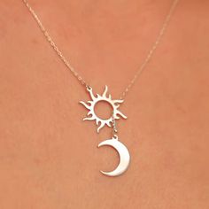 Looking for a unique and meaningful piece of jewelry? Our Sun and Moon Harmony Necklace embodies both balance and beauty, making it a perfect addition to any jewelry collection. Crafted with high-quality materials and expert attention to detail, this necklace features a beautiful sun and moon design that symbolizes harmony and balance. The pendant is crafted with intricate details and hangs from a delicate chain, making it a perfect piece for layering or wearing on its own. This Sun and Moon Har Sterling Silver Sun And Moon Pendant Charm Necklace, Sterling Silver Charm Necklace With Sun And Moon Design, Sterling Silver Pendant Necklace With Sun And Moon Design, Celestial Sun And Moon Sterling Silver Necklace, Sterling Silver Sun And Moon Spiritual Necklace, Celestial Jewelry With Sun And Moon Designs, Spiritual Sterling Silver Sun And Moon Necklace, Silver Sun Necklace With Sun And Moon Design, Sterling Silver Spiritual Necklace With Sun And Moon Design