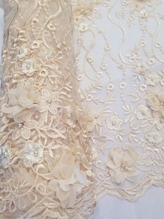 two pieces of lace with flowers on them