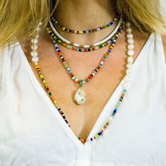 "Bright, vibrant beads make this necklace perfect addition to your summer sundress or a white blouse. African glass beads and white freshwater pearls are hand knotted along the silk cord to create a colorful and bright strand. Alone or layered with your favorites, this necklace exudes a playful, eclectic bohemian elegance. Necklace: 43\" Layer this necklace with: https://www.etsy.com/listing/637252353/baroque-pearl-and-turquoise-necklace?ref=shop_home_active_2 You might also like: https://www.et Summer Multi-strand Colorful Beaded Necklaces, Beaded Shell Necklace For Summer Festivals, Summer Festival Beaded Shell Necklace, Colorful Beads Strand Jewelry For Vacation, Colorful Beaded Strand Jewelry For Vacation, Summer Vacation Beaded Shell Necklace, Summer Multi-strand Beaded Necklaces, Colorful Beads Shell Necklace For Summer Vacation, Summer Vacation Shell Necklace With Colorful Beads