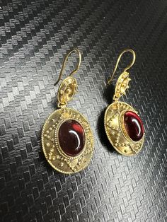 Beautiful 14k Yellow Gold Garnet Earrings Material: 14k Yellow Gold Gemstone: Garnet Type: Fishhook Total weight: 5.6 grams Time period of origin: circa 1870's Country of origin: England We have a GIA gemologist on our team. All jewelry items are authenticated. Antique Garnet Earrings, Garnet Earrings, Antique Earrings, Time Period, Fine Jewellery Earrings, Earrings Dangle, Fish Hook, Garnet, Jewelry Earrings Dangle