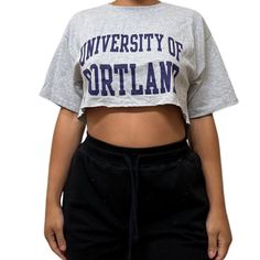 Vintage College Crop Tees Shop our vintage crop tees that vary from a range of different graphics and colors All items you see are unique and the only one available in our shop Items fit true to size All items have been cut and altered into a crop tee All items are pre-worn, recycled, well kept items that are perfect for game days, college gatherings, every day wear, and more! If you have any questions about fit or the items, please send me a message before purchase. Thank you and happy shopping Cropped Cotton T-shirt With Text Print, Crew Neck Cropped Shirt With Text Print For Streetwear, Cropped Crew Neck T-shirt With Graphic Print For College, Casual Cropped T-shirt With Letter Print For College, Streetwear Cotton Cropped Shirt With Logo Print, Crew Neck Cotton Cropped Shirt With Logo Print, Cotton Cropped Shirt With Logo For Streetwear, Cotton Crew Neck Cropped Shirt With Logo Print, Pre-shrunk Crew Neck Cropped T-shirt For Streetwear