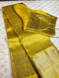 Indulge in luxurious elegance with this Golden yellow kanchipuram silk saree. This saree features a stunning geometric design in a rich golden yellow color, crafted from premium kanchipuram silk. Elevate your wardrobe with this exquisite piece, perfect for any special occasion. This saree is ready to wear with fall and pico done. Comes with stitched blouse - size: 38-46.  SILK MARK CERTIFIED Mustard Kanjeevaram Saree, Designer Tussar Silk Gold Kurta, Designer Gold Tussar Silk Kurta, Yellow Tissue Silk Kurta For Diwali, Wedding Tussar Silk Churidar, Designer Tissue Silk Kurta With Pallu, Transitional Gold Tussar Silk Kurta, Yellow Tissue Silk Sets For Transitional Season, Elegant Zari Work Kurta For Puja