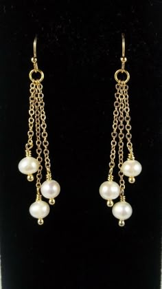 "Sophisticated and Elegant Pearl Earrings that feature beautiful white Swarovski Pearls that gracefully dangle from gold filled chains. The chains are all different lengths making these earrings perfect to add the right touch of elegance to any wedding dress or bridesmaids dress. Each is suspended from gold filled ball french ear wires. [MATERIALS] * High Quality Swarovski Pearls * Dainty 14kt Gold Filled Chain * 14kt Gold Filled Ear Wires These beautiful earrings measure (47mm) 1-7/8\" in lengt Dangle Chain Earrings, Wedding Jewelry Gold, Dangle Pearl Earrings, Bridesmaid Pearl Earrings, Diy Wire Earrings, Pearl Earrings Gold, Neck Pieces Jewelry, Gold Chain Earrings, White Pearl Earrings