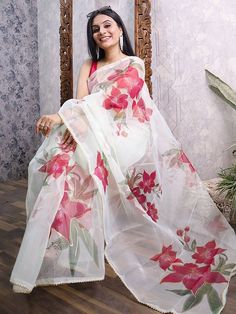 Real looks will come out through the dressing style and design with this gorgeous off-white color saree made with organza material accomplished with floral and foil printing. This off-white designer saree comes with a pink color blouse made with heavy banglory material. This lovely organza off-white party wear saree is 5.50 meters long and comes with unstitched 1.00-meter blouse material. This organza off-white party wear saree is a wonderful garment that elegantly flaunts the curves of a woman White Floral Print Traditional Wear For Eid, White Traditional Wear For Diwali, Floral Print Saree For Wedding, Festive White Traditional Wear With Floral Print, Traditional Off White Floral Print Dupatta, White Saree With Pallu For Diwali, White Art Silk Saree, White Art Silk Saree For Festivals, White Traditional Wear With Floral Print