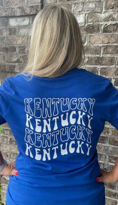 New Retro Kentucky shirt! Vintage Kentucky design with smiley face on front left chest!  Unisex Sizing!  🔹T SHIRTS🔹 Toddler 2T-5T Youth XS- Youth XL Adult S-XL Adult 2X Adult 3X 🔹LONG SLEEVE & SWEATSHIRTS🔹 Toddler 2T-5T Youth XS- Youth XL Adult S-XL Adult 2X Adult 3X If you would like to request a custom order,   please send us a message! School Spirit Top With Logo Print And Relaxed Fit, Fun Relaxed Fit T-shirt For Fan Merchandise, Casual Pre-shrunk Shirt For Fan Merchandise, Casual Pre-shrunk Shirt For Fans, Fun Everyday T-shirt, Cotton School Spirit T-shirt, School Spirit Cotton T-shirt For Everyday, Cotton T-shirt With School Spirit For Everyday, Fun Cotton T-shirt For College