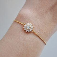 Daisy Bracelet // Flower Bracelet // Bridal Jewelry // Adjustable Bracelet // Box Chain Bracelet // Bridesmaids Gift // Wedding Jewelry // Thank You Gift // Best Friend Gift This dainty box chain bracelet is adjustable and adorned with two tiny cubic zirconia charms at each end. Featured in the center is a sparkling cubic zirconia daisy flower. Whether searching for a little thank you gift for a best friend or something special for your wedding day, all of my jewelry arrives suitably gift wrapped ready for gift giving.  Measurements: The daisy bracelet is adjustable by gently moving the gold slider for a comfortable fit Metals: Gold plated adjustable box chain Gold plated cubic zirconia  For more bridal bracelets: https://www.etsy.com/shop/FawningInLove?ref=shop-header-name&listing_id=1314 Box Chain Gold, Bridal Bracelets, Gift For A Best Friend, Bracelet Flower, Daisy Bracelet, Bracelet Box, Greenwich Ct, Gift Best Friend, A Best Friend