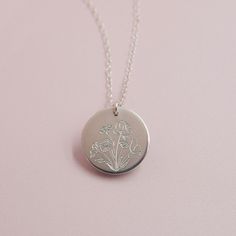 Our Wildflower necklace features a beautiful floral bouquet design engraved on the front, with the option to add a word, initials or a date on the back (or just keep it blank).DETAILS: 14kt gold filled or sterling silver choose chain length, model wearing 17" include back engraving instructions when ordering we can fit up to 8 characters on the back Wildflowers are said to symbolize joy and the idea that life doesn't always have to grow according to plan to still be quite beautiful. Celebrate so Wildflower Necklace, Flower Necklace Gold, Deer Jewelry, Bouquet Design, Engraved Necklace, A Word, Floral Bouquets, Flower Necklace, Bar Necklace