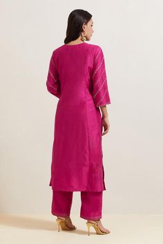 Pink natural weaves chanderi silk kurta with contrast paisley and floral embroidery. Comes with pant and shimmer organza dupatta.
Components: 3
Pattern: Embroidered
Type Of Work: Floral and Paisley
Neckline: Notched
Sleeve Type: Three Quarter
Fabric: Chanderi Silk, Shimmer Organza
Color: Pink
Other Details: 
Embroidered hem pant
Fringed border dupatta
Occasion: Puja - Aza Fashions Silk Kurta With Resham Embroidery For Diwali, Straight Kurta With Resham Embroidery In Slub Silk, Traditional Wear Resham Embroidery Straight Kurta, Silk Kurta With Chikankari Embroidery For Navratri, Unstitched Kurta With Chikankari Embroidery In Slub Silk, Silk Kurta With Zari Work For Navratri, Navratri Silk Kurta For Designer Wear, Diwali Unstitched Slub Silk Suit, Navratri Designer Silk Kurta