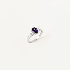 This exquisite ring whispers tales of twilight with its enchanting design and serene aura. Handcrafted with meticulous attention to detail, it exudes an air of elegance that speaks volumes of sophistication and style. Adorned with an oval-cut amethyst birthstone and complemented by CZ accents, this ring captures the essence of February birthdays. The amethyst, a symbol of serenity and spirituality, adds a touch of mystique and allure to the piece, making it a perfect gift for those born in this Elegant Promise Birthstone Ring With Gemstone Accents, Timeless White Gold Crystal Ring Gift, Timeless Birthstone Ring For Gifts, Classic Cubic Zirconia Birthstone Ring, Elegant Crystal Ring With Gemstone Accents As Promise Ring, Elegant Crystal Ring With Gemstone Accents For Promise, Elegant Crystal Promise Ring With Gemstone Accents, Elegant Birthstone Ring With Gemstone Accents As Gift, Elegant Sterling Silver Birthstone Ring With Gemstone