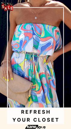 a woman in a colorful dress holding a purse and wearing a necklace with the words refresh your closet on it