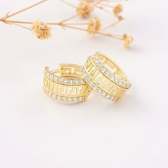 "Hoop 2 Channel 10K 14K 18K Solid Gold Latch Back Earring * Sold as Pair * Simulated Diamond CZ (Cubic Zirconia)* 0.53\" / 13mm outer diameter * 100% 10K 14k 18K Solid Yellow Gold (Not Gold Vermail or Not Gold Plated) * Sold as Pair * Cubic Zirconia clear simulated diamonds * 0.53inch outer, 0.43inch inner diameter *     13mm outer,      11mm inner diameter * Hinge hoops click in place for a secure comfortable fit * Polished finish EU and UK taxes; *EU and UK orders over £135/€150 are subject to customs, import duties and tax charges once they reach their destination. This means that the recipient will be responsible for all customs, import duties and sales taxes that may apply locally to the purchase." Traditional Yellow Gold Filigree Plug Earrings, Elegant Tarnish-resistant Yellow Gold Plug Earrings, Channel Earrings, Traditional Yellow Gold Nickel-free Hoop Earrings, Nickel-free Yellow Gold Plated Plug Earrings, Nickel-free Yellow Gold Round Plug Earrings, Greek Style, Solid Gold Earrings, Experience Gifts