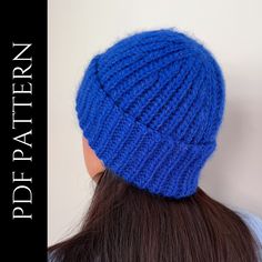 a woman wearing a blue knitted hat