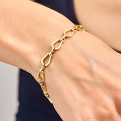 Handcrafted with care, this exquisite piece features a delicate horseshoe charm that exudes timeless charm and grace. The high-quality solid gold chain adds a touch of luxury, making it a perfect accessory for everyday wear or special occasions. Choose from rose gold, white gold, or classic yellow gold in 14 karat options to complement your personal style. This stunning bracelet makes for a thoughtful and meaningful gift for yourself or someone special, symbolizing good fortune and a stylish sta Classic Bangle Charm Bracelet For Formal Occasions, Formal Yellow Gold Horseshoe Jewelry, Luxury Horseshoe Jewelry For Formal Occasions, Luxury Horseshoe-shaped Formal Jewelry, Elegant Bracelets With Clasp, Elegant Charm Bracelet With Spring Ring Clasp, Classic Yellow Gold Horseshoe Jewelry, Oval Link Bracelets With Clasp, Timeless Bracelets With Spring Ring Clasp