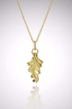 Gold & Stone Necklace - This oak leaf necklace was first carved in wax and cast in 18k gold; it boasts a 2mm round cognac diamond, bezel-set on the side of the piece. Can be artistically layered with multiple necklaces to create a fun and modern look, or worn alone as a statement unto itself! Lobster clasp closure. Gold Stone Necklace, Multiple Necklaces, Oak Leaf Necklace, Cognac Diamonds, Artful Home, Oak Leaf, Gold Stone, Leaf Necklace, Pearl Diamond