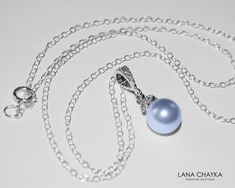 Wedding Swarovski 8mm Light Blue Pearl Drop Pendant with .925 Sterling Silver Chain Bridal Necklace. CHAIN is 18 inches (45.7cm) long. PENDANT is about 0.75 inch (2cm) long including bail. Elegant and timeless, this dainty necklace is perfect for weddings or special occasions such as birthdays, anniversaries, graduations, proms...or whatever you can imagine! Handmade necklace, is with .925 Sterling Silver 18 inches cable chain, Swarovski 8mm Light Blue round crystal pearl, Rhodium Sterling Silve Elegant Light Blue Necklace For Anniversary, Elegant Light Blue Round Pendant Necklace, Blue Pearl Pendant Jewelry For Wedding, Formal Blue Necklace With Pearl Pendant, Elegant Light Blue Necklace For Wedding, Elegant Light Blue Wedding Necklaces, Blue Round Pendant Necklace For Wedding, Blue Sterling Silver Jewelry For Bridesmaid Gift, Sterling Silver Blue Jewelry For Bridesmaid Gift