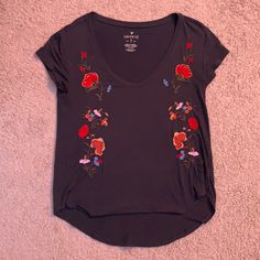 Super Cute American Eagle Shirt, Fits So Good And Looks Brand New!! A Size Small But Fits Small To Medium But Even Large If You Wanted It To Be Tighter. Trendy Short Sleeve Tops With Floral Embroidery, Trendy Floral Embroidered Short Sleeve Tops, Casual V-neck T-shirt With Floral Embroidery, Casual V-neck Shirt With Floral Embroidery, Summer Floral Embroidered V-neck T-shirt, Casual V-neck Top With Floral Embroidery, Floral Embroidered V-neck Top With Relaxed Fit, American Eagle Shirt, Eagle Shirts