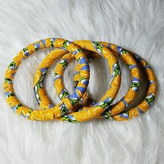 This Lovely African Print Bracelets Is Handmade Made. You Get 4 Bracelets With The Price Below Adjustable Yellow Round Bangle, Handmade Yellow Bangle Jewelry, Yellow Bangle Bracelet For Gift, Adjustable Yellow Bangle For Gift, Handmade Yellow Jewelry For Friendship, Adjustable Yellow Bracelets For Friendship, Adjustable Yellow Bracelet For Friendship, Handmade Yellow Bangle Bracelets, Yellow Friendship Bangle Jewelry