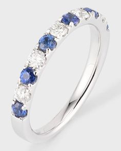 a white gold ring with blue and white stones