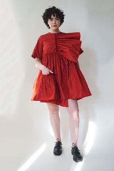 The Farfalle Babydoll Dress is a bold trapeze-cut dress in rich silk taffeta. A gathered silk panel on the bodice can be worn as a sculptural detail or a romantic cascading neckline. Raw edge ruffled seams, a dance-everywhere dressed up/down silhouette, finished with a delicate front pocket for stashing after-dinner mints. Loose billowing fit. Keyhole back closure. Pre-order only, ships late Summer 2022. Taffeta Dresses With Gathered Sleeves, Voluminous A-line Dress With Ruffles, Chic Ruched Taffeta Dresses, Voluminous Bubble Hem Dresses, Chic Voluminous Taffeta Dress, Summer Ruched Taffeta Dress, Billowy Dresses For Gatherings, A-line Taffeta Dress With Ruffles, Silk Dress With Voluminous Gathered Skirt