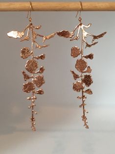 I have made this stunning pair of earrings using the most beautiful soft Italian rose gold leather. They are so incredibly lightweight, you will forget that you are even wearing earrings. They are intricately cut to give the appearance of a delicate hanging flower. They measure 3.5 inches in length and the earring hooks are gold plated. Elegant Rose Gold Copper Earrings, Gold Flower-shaped Copper Earrings, Rose Gold Copper Dangle Earrings, Rose Gold Copper Drop Earrings, Electroformed Rose Gold Dangle Earrings, Angel Wing Earrings, Leather Flower, Hanging Flower, Earrings Rose Gold