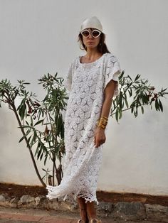 Amazing one off a kind white vintage crochet short dress up-cycled by Vagabond Ibiza with very find handmade crochet details We hand source antique and vintage crochet & lace textiles and up-cycle it here in Ibiza in to unique on off a kind garment just for you. Due to the nature there could be some imperfections but we do our best to only recycle mint condition textiles. Size is medium Condition is perfect White Crochet Lace Maxi Dress For Beach, White Lace Maxi Dress For Summer, Bohemian Beach Cover-up Dress With Lace Patchwork, White Bohemian Crochet Maxi Dress, White Crochet Lace Maxi Dress For Vacation, Spring Bohemian Crochet Dress With Lace Patchwork, Bohemian Summer Lace Dress With Lace Trim, Hippie Beach Dresses With Lace Trim, Vintage Lace Patchwork Beach Dress