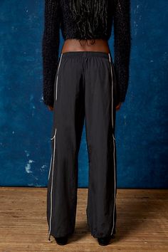 Effortless track pants from BDG. Our BDG Jess nylon track pants have an easy fit with a low rise and a relaxed straight leg. Essential track pants styling with contrasting piping at the sides. Find these staple track pants only at Urban Outfitters. Features BDG Jess nylon track pants Wide leg track pant Mid rise elasticated waistband Side pockets Piping down the legs Relaxed, straight-leg fit Full length Pull-on style UO exclusive Content + Care 100% Nylon Machine wash Imported Size + Fit Model Sporty Relaxed Fit Straight Parachute Pants, Sporty Straight Parachute Pants With Relaxed Fit, Sporty Parachute Pants With Relaxed Fit, Sporty Spring Parachute Pants In Straight Cut, Sporty Straight Leg Parachute Pants For Streetwear, Sporty Streetwear Parachute Pants With Straight Leg, Sporty Stretch Parachute Pants Straight Leg, Sporty Stretch Straight Leg Parachute Pants, Sporty Parachute Pants With Straight Leg And Elastic Waistband