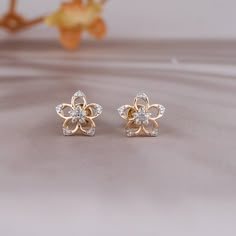 Flower Shape Diamond Stud Earrings, Brilliant Round Cut Natural Diamond Studs, Stud Diamond Earrings in 14K Yellow Gold Product Details:  ● Metal: 14k Solid Gold   ● Stone: Natural Diamond  ● Stone Shape: Round  ● Diamond Weight: 0.08 CT   ● Gold Weight: 1.02 gram   ● Band Color: Yellow Gold   ● Certificate:  Certificate of natural diamond will also come Handmade Stud Earrings you can choose from Please contact us, we'll customize it for you.  Customized Order ✦✦ We can also customize your dream design stud earrings as per your preference with different cut, carat size, and clarity VVS, VS, and SI. We can also make jewelry in all-metal types like 925 Silver, 10 KT Gold, 14 KT Gold, 18 KT Gold, and also, also your personalized ring with rose, yellow or white gold. Thank You So Much Gold Flower Earrings Studs, Diamond Earrings Studs Indian, Studs Earrings Gold India, Gold Earrings Studs Simple, Flower Diamond Earrings, Simple Elegant Necklace, Latest Earrings Design, Small Earrings Gold, Nose Ring Jewelry