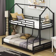 a black metal bunk bed sitting on top of a hard wood floor next to a white bath tub