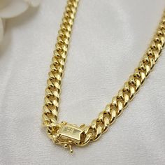 Stunning semi solid 14k yellow gold 7.5MM thick miami cuban chain. Perfect for everyday and every occasion. Sturdy, versatile, and everlasting. 14k gold will not tarnish or rust. Perfect gift. Materials: 14k gold Lenght: 22 inches, 24 inches Thickness: 7.5MM Weight: 35.1 grams, 39 grams (Aprox). 14k stamped Box lock Shipping with UPS,, a signature will be required. Briza Collections is a small family business that works hard on providing the best selection of Fine Solid Gold Jewelry for the best 14k Gold Cuban Link Chain Necklace, 14k Gold Cuban Link Necklace For Formal Occasions, Formal Cuban Link Box Chain Necklace, Gold 14k Cuban Link Necklace, Gold Cuban Link Necklace In 14k Gold, Cuban Link Curb Chain Necklace, Gold Tarnish Resistant Cuban Link Necklace, Yellow Gold Cuban Link Necklace As Gift, Yellow Gold Cuban Link Necklace Gift