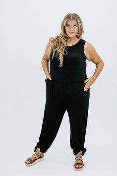 BEST SELLING JUMPSUIT! This gorgeous black jumper is simply perfect for all of your seasonal adventures! It features a high scoop neckline with an elastic waistband. This jumpsuit is practical and so comfortable & the wide leg cut is so trendy! Strut your stuff at any event with a pair of heels and some dazzling earrings - you're sure to stand out from the crowd!! This has been a returning best seller- it is so flattering on every body type! You won’t regret this purchase! Unlined Cinched waist Dazzling Earrings, Black Jumper, Cinched Waist, Black Jumpsuit, Body Types, Black Media, Scoop Neckline, The Struts, Jumper