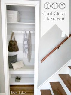 an open closet with clothes hanging on the wall and stairs leading up to the second floor