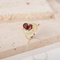 Gorgeous vintage-inspired natural garnet engagement ring, a stunning piece of jewelry perfect for all occasions. Handmade with care and attention to detail, this ring is made to order in Canada and ships from a small business. You have the option to choose between sterling silver or solid gold when crafting this ring and features a beautiful natural garnet stone. ►RING DETAILS: ✦Material: 925 sterling silver, Solid 10k/14K/18K GOLD (can be made in white/rose/yellow gold) ✦Band Width:  2 mm ✦Main Stone: 2 Natural Garnet ，6X8 mm Pear Shaped （1.4CT），5X7 mm Pear Shaped （0.8CT） ✦Accented stones ：None  ►Processing Time and Shipping: This ring is a made-to-order item and requires 2-3 weeks of processing time after payment is received. But don't worry; it'll be worth the wait. The ring is shipped Garnet Open Ring For Anniversary, Anniversary Garnet Ring, Garnet Open Ring Birthstone Ring, Garnet Open Ring Birthstone Gift, Garnet Birthstone Ring With Accent Stones, Garnet Birthstone Ring With Accent Stones As Gift, Garnet Birthstone Ring As A Gift, Garnet Birthstone Open Ring, Burgundy Garnet Gemstone Ring