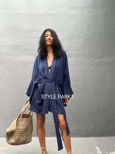 2025 New color The putu Kimono Perfect for a swimsuit cover up on the beach or by the pool , with shorts and a tank top or over a summer dress. At home wear  Stylepark1 Model  -Her height is 175Cm/5.74ft weight is 57Kg/125IB /American size, she wore  ~ M  size.  Color:Bali  Tie dye Ocean navy blue  motif One size fit      One size      Model wore / B   A  - Length - 95cm/37inch        Width - Chest & hip          85cm /66.92inch/round         I recommend American size XL to XXXL  B - Length - 85cm/33.46inch        Width - Chest & hip          75cm/150cm (59inch) round         I recommend American size M to XL   C - Length - 85cm/33.46inch       Width - Chest & hip         65cm/130cm/51inch (round)         recommend American size S to L Made from soft Rayon /Hand cool wash  At first, you ma Relaxed Fit Summer Loungewear Cover-up, Chic Summer Cover-up With Relaxed Fit, Summer V-neck Beachwear Robe, Casual Spring Beach Cover-up Robe, Beach Season Tie Waist Cover-up For Day Out, Casual Wrap Cover-up For Poolside, Blue Wrap Kimono For Summer, Chic Summer Kimono For Vacation, Summer Beachwear Wrap Kimono