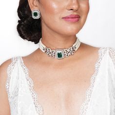 Emerald Choker features stunning green diamonds and CZ stones, complemented by elegant pearls.  Inspired by Indian design, this jewelry set blends classic and modern contemporary styles. Perfect for brides, it makes a thoughtful and luxurious gift for her, adding sophistication and charm to any special occasion. *𝐏𝐑𝐎𝐃𝐔𝐂𝐓 𝐃𝐄𝐓𝐀𝐈𝐋* * 𝐌𝐚𝐭𝐞𝐫𝐢𝐚𝐥: Brass * 𝐏𝐥𝐚𝐭𝐢𝐧𝐠: White Rhodium Plated * 𝐒𝐭𝐨𝐧𝐞: AAA-quality CZ Diamond & Emerald, Pearl. *𝐃𝐈𝐌𝐄𝐍𝐒𝐈𝐎𝐍𝐒* *𝐍𝐞𝐜𝐤𝐥𝐚 Emerald Jewelry Set, Emerald Choker, Bride Wedding Gift, Choker Pearl, Green Diamonds, Pearl Stone, Indian Jewelry Sets, Wedding Gifts For Bride, Diamond Choker