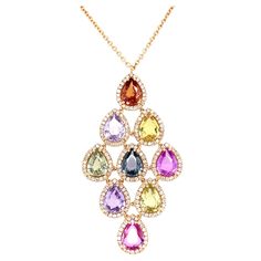 18K rose gold pendant is from Riad Collection. This beautiful necklace is made from 9 pear shape multi-coloured sapphires in total of 10.23 Carat and white diamonds in total of 0.94 Carat. Total metal weight is 9.77gr. The pendant is 5cm long. Rose gold chain is 44 cm long. Perfect for any great occasion! The Riad Collection is the spring/summer 2022 collection of Vitale 1913. Inspired by the colorful oriental gardens of Marrakech, and their geometric shapes, Riad recalls our deep Mediterranean roots and connects them to Mediterranean and Middle East interior design, with distinguished inner courtyards, decorated with water fountains, surrounded by lush vegetation bursting with palm trees and varied fauna, with geometric patterns. Diamond Necklace Indian, Gold Diamond Drop Earrings, Round Diamond Pendant, Sapphire Diamond Pendant, Pear Pendant, Multi Sapphire, Rose Gold Chain, Rose Gold Pendant, Elegant Pendant