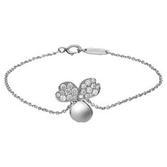 Sleek and modern Tiffany & Co. Paper Flowers diamond chain bracelet. Crafted in lustrous platinum. This bracelet features a center flower charm studded with round brilliant cut diamonds on two petals. Total diamond weight: 0.17 carat. Bracelet length: 6.5 inches. Flower size: 12.4mm. Total weight: 2.60 grams. Secured with a spring ring lock closure. Super stackable and easy to wear. Comes with a Tiffany box and pouch. Luxury Diamond Bracelets For Evening With Polished Finish, Luxury White Gold Diamond Bracelet With Chain, Luxury White Gold Diamond Chain Bracelet, Luxury Chain Bracelets For Wedding, Luxury White Gold Chain Bracelet With Polished Finish, Elegant Sterling Silver Bracelet With White Gold Chain, Luxury White Gold Chain Bracelet For Wedding, Sterling Silver White Gold Diamond Chain Bracelet, Sterling Silver Diamond Bracelet With Chain In White Gold