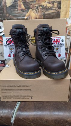 These are a very rare pair of safety rated steel toe Dr Martens boots. The boot itself has 6 speed lace eyelets and comes above the ankle,and have a nice leather padded collar offering extra comfort . The sole unit is the Hud version. They were only used on this and a couple of other boots. Super strong and extremely comfortable. This boot was made in Asia, but to an extremely high standard. They will last those who buy many years. We have UK sizes 3-6 available  European sizes 36-39 USA ladies Brown Steel Toe Lace-up Waterproof Boots, Brown Steel Toe Waterproof Lace-up Boots, Steel Toe Lace-up Boots For Streetwear, Streetwear Steel Toe Ankle Martin Boots, Rugged Lace-up Hiking Boots With Protective Metal Feet, Rugged Martin Boots With Reinforced Toe For Outdoor Work, Industrial Work Boots With Steel Toe, Brown Shock Resistant Work Boots With Round Toe, Steel Toe Work Boots For Hiking