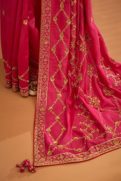 Editor's Note A fuschia pink zardozi embroidered dupion silk sari and blouse would be a stunning and bold choice for a formal occasion. The rich and luxurious fabric of the dupion silk would dr... Zardozi Work, Zardozi Embroidery, Fuschia Pink, Dupion Silk, Silk Sari, Blouse For Women, Indian Fashion Designers, Work Sarees, Silk Embroidery